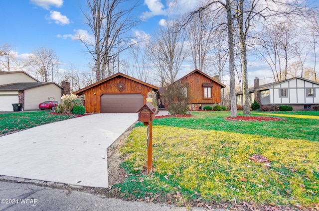 view of front of property with a garage and a front yard