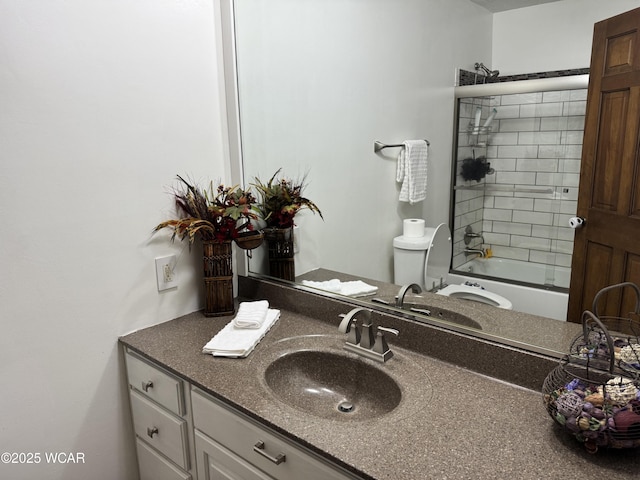 full bathroom with enclosed tub / shower combo, toilet, and vanity