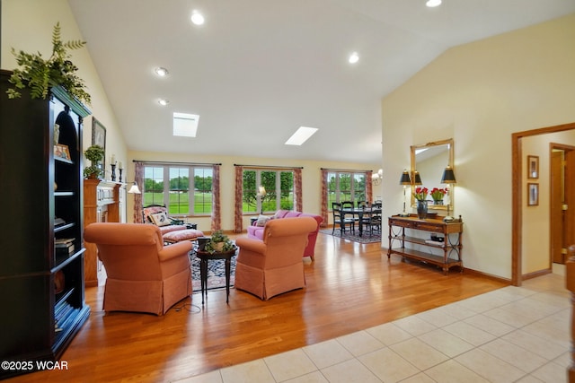 4042 Bur Oak Trl, Lima, OH 45807 - living room with plenty of natural light, light tile patterned floors, high vaulted ceiling, recessed lighting, and a skylight