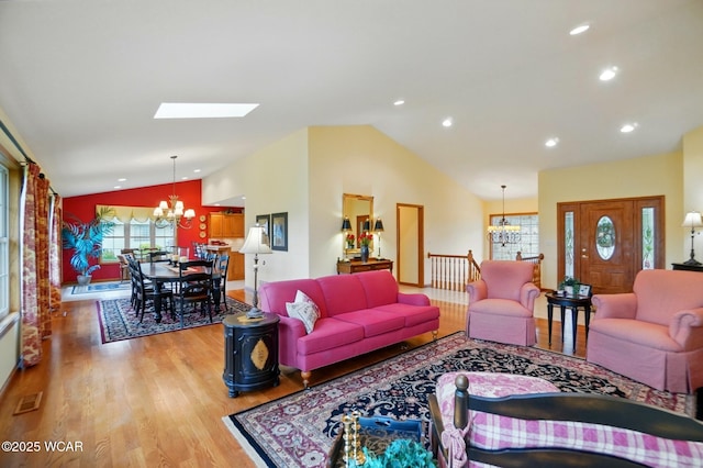 4042 Bur Oak Trl, Lima, OH 45807 - living area featuring a chandelier, vaulted ceiling, light wood-style flooring, recessed lighting, and a skylight
