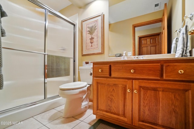 4042 Bur Oak Trl, Lima, OH 45807 - bathroom featuring tile patterned floors, toilet, a shower with door, and vanity