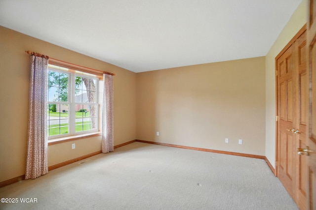 4042 Bur Oak Trl, Lima, OH 45807 - unfurnished room with baseboards and light colored carpet