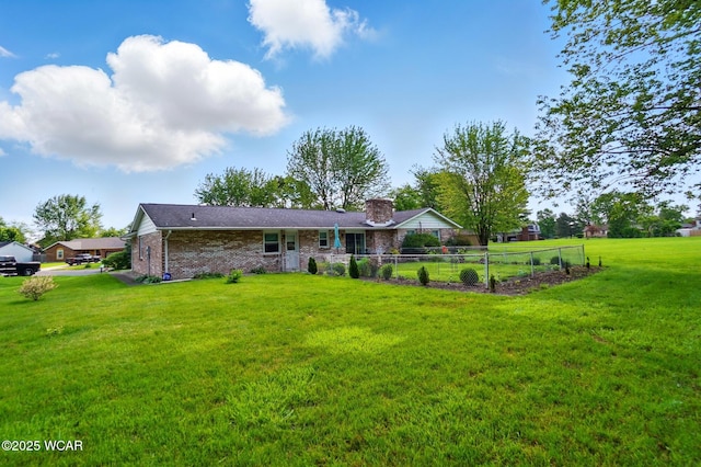2101 Kimberly Dr, Lima, OH 45805 - rear view of house with brick siding and a chimney