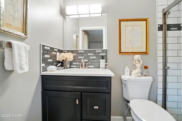 2101 Kimberly Dr, Lima, OH 45805 - full bathroom with backsplash, vanity, toilet, a tile shower, and baseboards