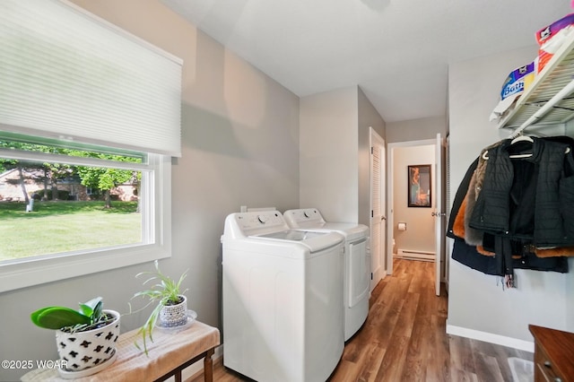 2101 Kimberly Dr, Lima, OH 45805 - laundry room with a baseboard heating unit, washing machine and dryer, wood finished floors, and baseboards