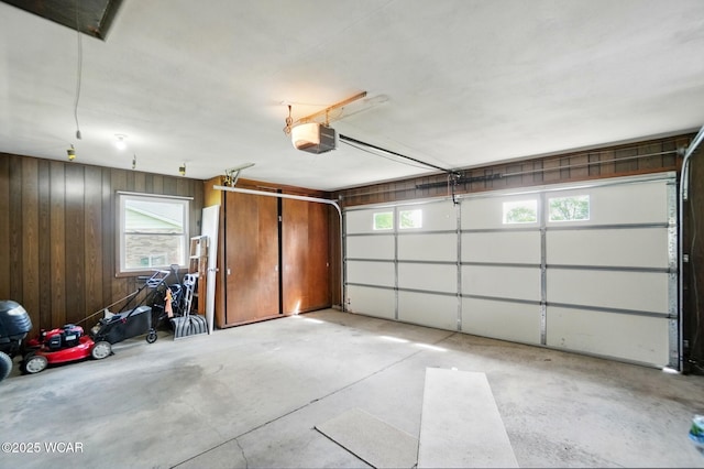 2101 Kimberly Dr, Lima, OH 45805 - garage with wood walls and a garage door opener