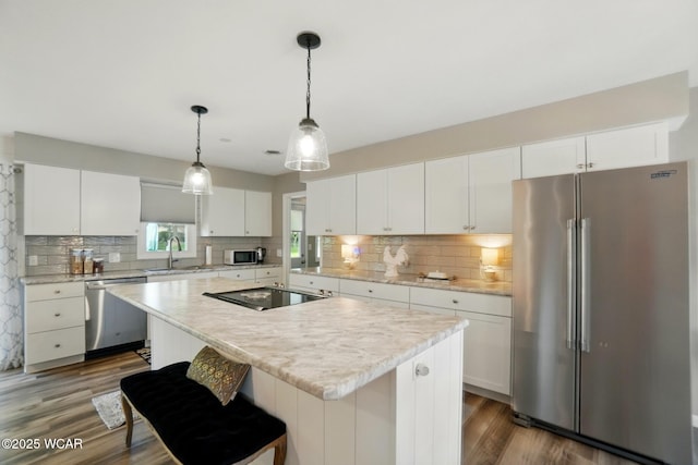 2101 Kimberly Dr, Lima, OH 45805 - kitchen with stainless steel appliances, dark wood-type flooring, light countertops, and a sink
