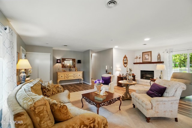 2101 Kimberly Dr, Lima, OH 45805 - living room with wood finished floors, a fireplace, recessed lighting, and baseboards