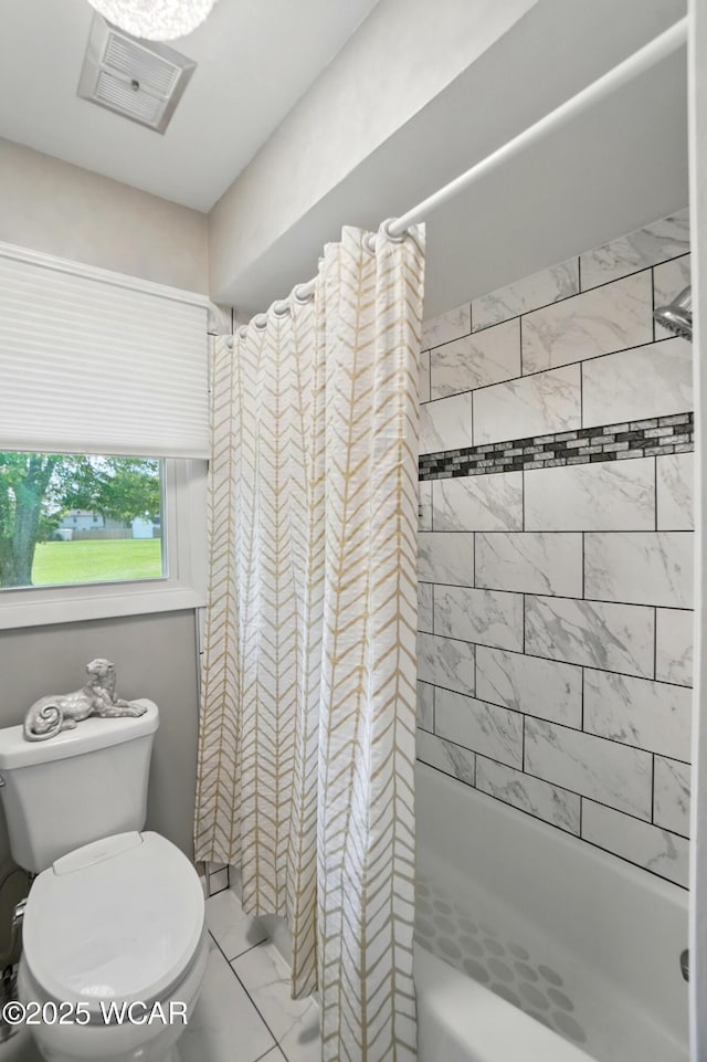 2101 Kimberly Dr, Lima, OH 45805 - bathroom with marble look tile flooring, shower / bathtub combination with curtain, and toilet