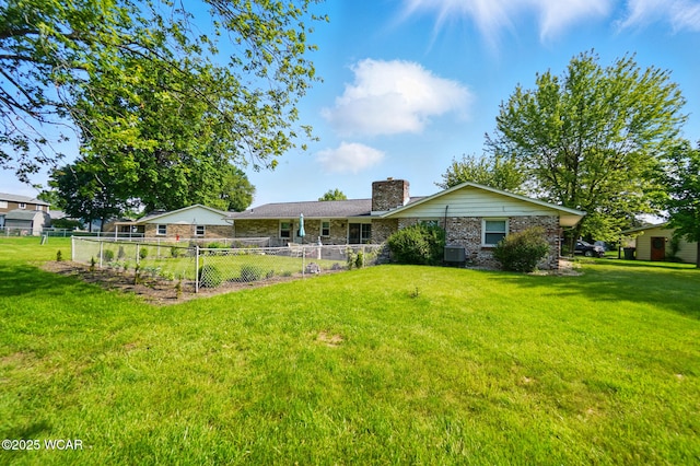 2101 Kimberly Dr, Lima, OH 45805 - back of property featuring a chimney and stone siding