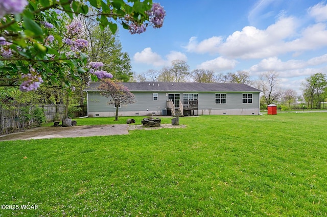 914 Howard St, Findlay, OH 45840 - rear view of house with crawl space, a patio area, an outdoor fire pit, and a wooden deck