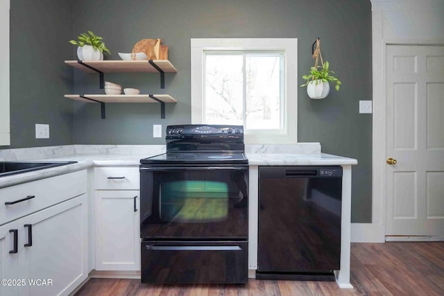 kitchen with black appliances, white cabinets, wood finished floors, and open shelves