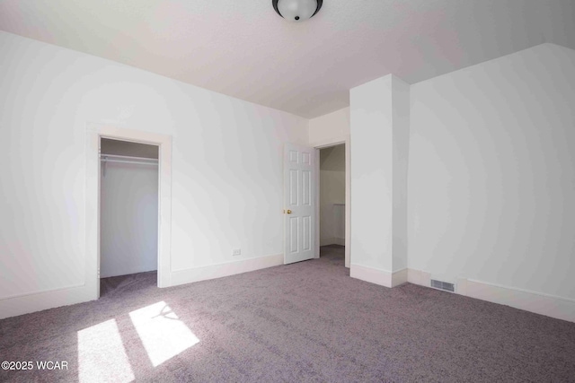 unfurnished bedroom featuring carpet floors, a closet, and baseboards