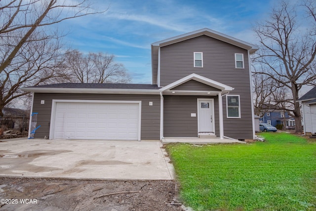 view of front property with a garage and a front lawn