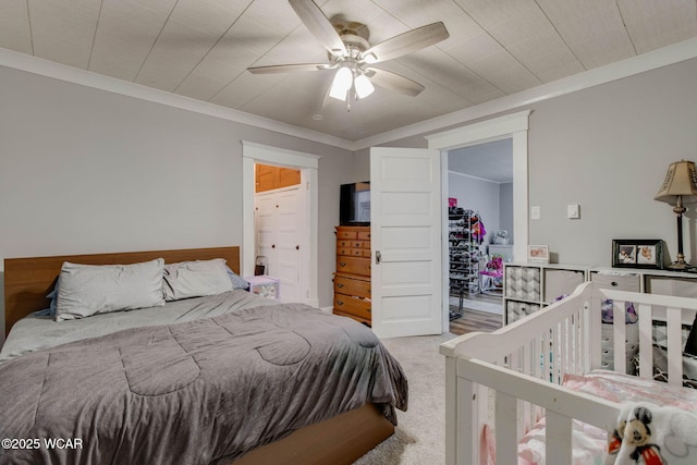 608 W Pearl St, Wapakoneta, OH 45895 - bedroom with carpet flooring, crown molding, a closet, and a ceiling fan