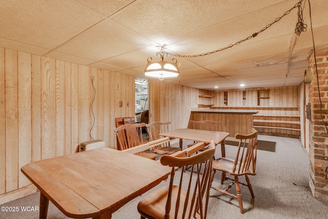 608 W Pearl St, Wapakoneta, OH 45895 - dining room featuring wooden walls, carpet, and a dry bar
