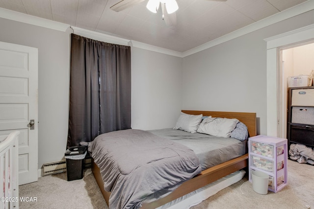 608 W Pearl St, Wapakoneta, OH 45895 - carpeted bedroom with ornamental molding, a ceiling fan, and a baseboard heating unit