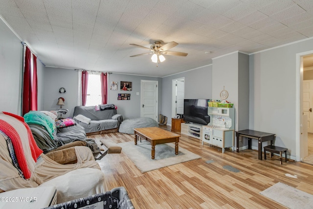 608 W Pearl St, Wapakoneta, OH 45895 - living area with crown molding, wood finished floors, and a ceiling fan