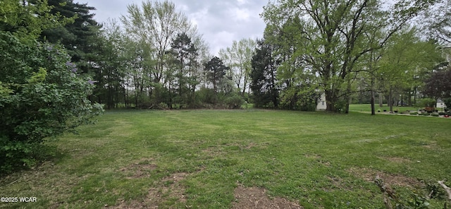 2971 Ft Amanda Rd, Lima, OH 45805 - back of house featuring a lawn, central AC, a chimney, and a sunroom