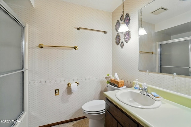 1317 Larry St, Van Wert, OH 45891 - full bath featuring vanity, wallpapered walls, and shower / bath combination with glass door