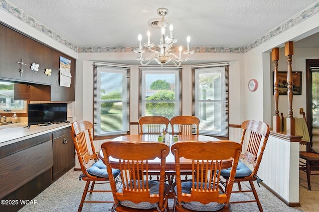 1317 Larry St, Van Wert, OH 45891 - dining room featuring a textured ceiling, a chandelier, and light carpet