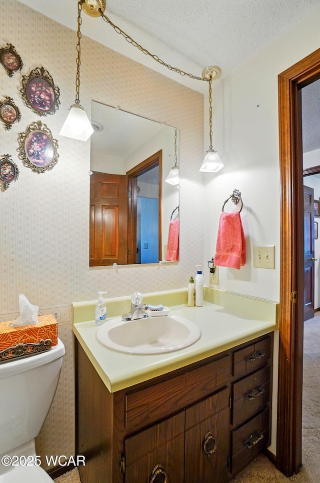 1317 Larry St, Van Wert, OH 45891 - bathroom with vanity, wallpapered walls, and a textured ceiling