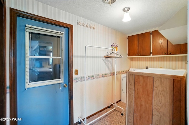 1317 Larry St, Van Wert, OH 45891 - laundry area with cabinet space, washer / clothes dryer, wallpapered walls, and a textured ceiling