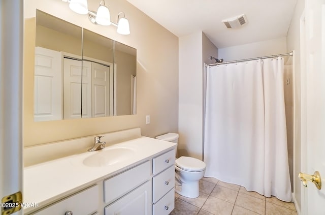 bathroom with toilet, a shower with shower curtain, vanity, visible vents, and tile patterned floors