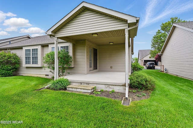 295 Brookview Ct, Lima, OH 45801 - rear view of property with covered porch and a lawn