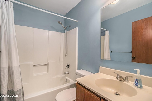 full bathroom featuring shower / tub combo with curtain, vanity, and toilet