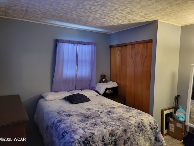 carpeted bedroom with a closet