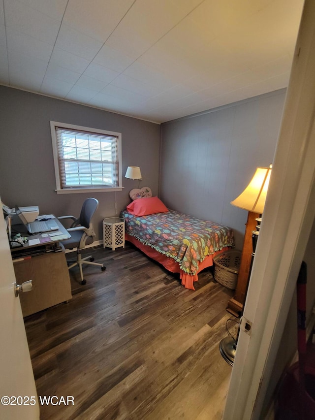 bedroom featuring dark wood-style floors