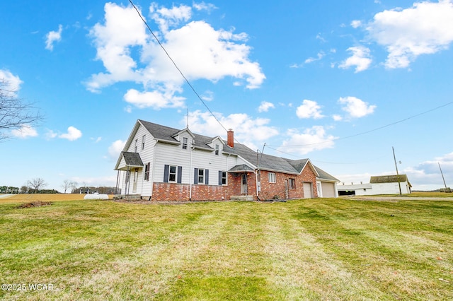 view of front of home featuring a garage and a front yard