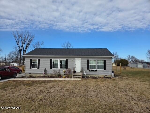 ranch-style house featuring a front yard