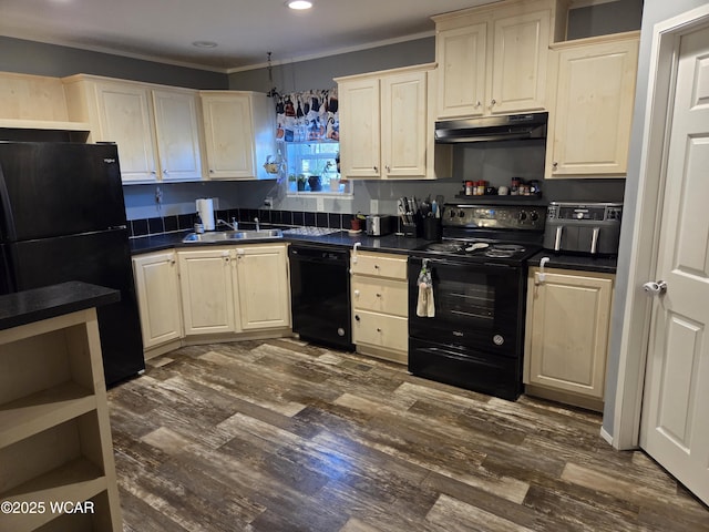 kitchen with dark hardwood / wood-style flooring, sink, black appliances, and cream cabinetry