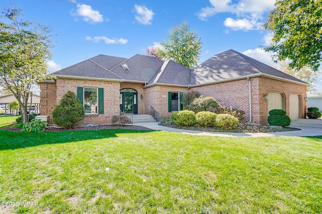 view of front of home with a garage and a front lawn