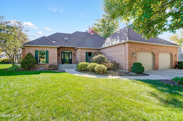 view of front of house with a garage and a front lawn