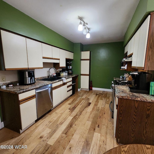 kitchen featuring white cabinetry, appliances with stainless steel finishes, and sink