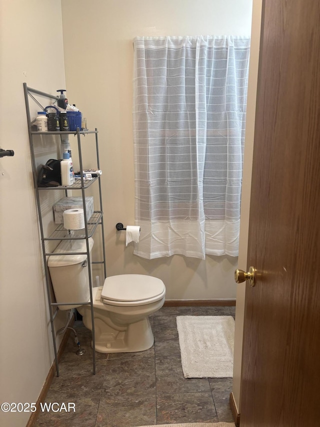 bathroom featuring toilet