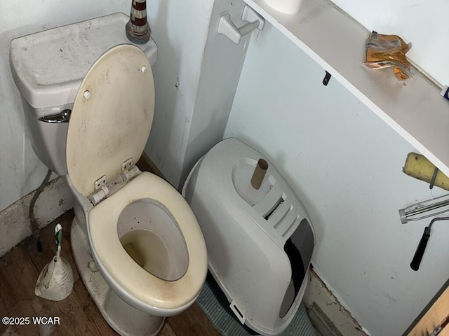 1027 W Elm St, Lima, OH 45805 - detailed view of toilet and wood finished floors