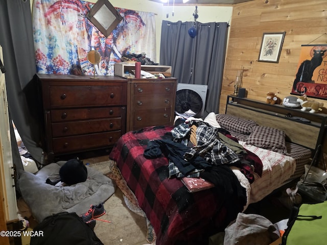 bedroom with wood walls
