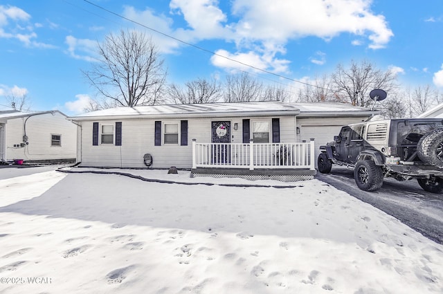 single story home with a garage and covered porch