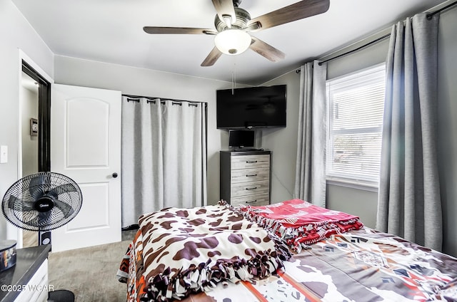 bedroom with light colored carpet and ceiling fan