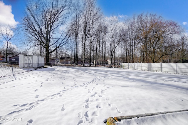 view of yard layered in snow