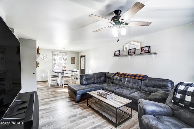 living room featuring hardwood / wood-style flooring and ceiling fan