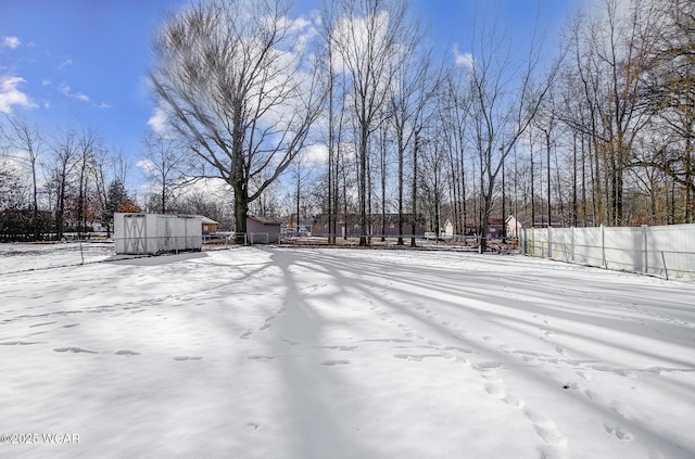 view of yard layered in snow