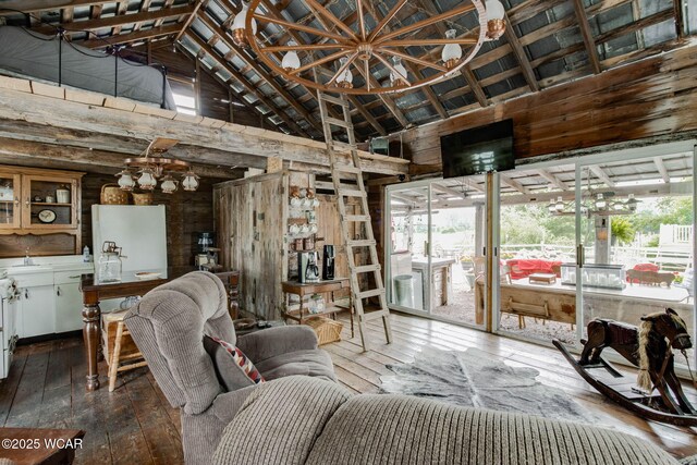 5065 Amherst Rd, Lima, OH 45806 - living room with a chandelier, high vaulted ceiling, wood-type flooring, plenty of natural light, and wooden walls