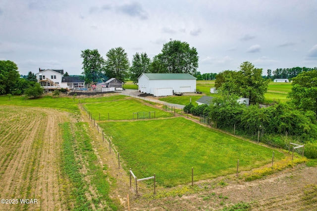 5065 Amherst Rd, Lima, OH 45806 - view of yard with a detached garage, an outbuilding, a view of countryside, and a pole building