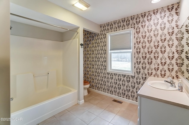 full bath with toilet, vanity, visible vents, tile patterned floors, and wallpapered walls