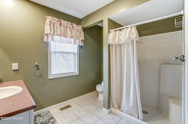 full bathroom with toilet, a stall shower, visible vents, and vanity